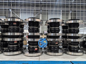 Double sphere rubber expansion joint for pipelines, showing flexible twin-bulb rubber bellows with metal flanges for vibration absorption and pipe movement compensation.